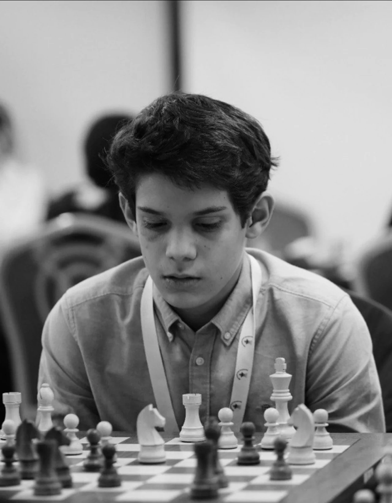 Jan concentrating over a chess board